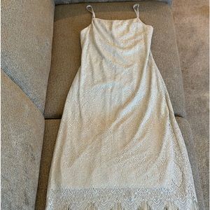 Beautiful lace dress with silver accents.